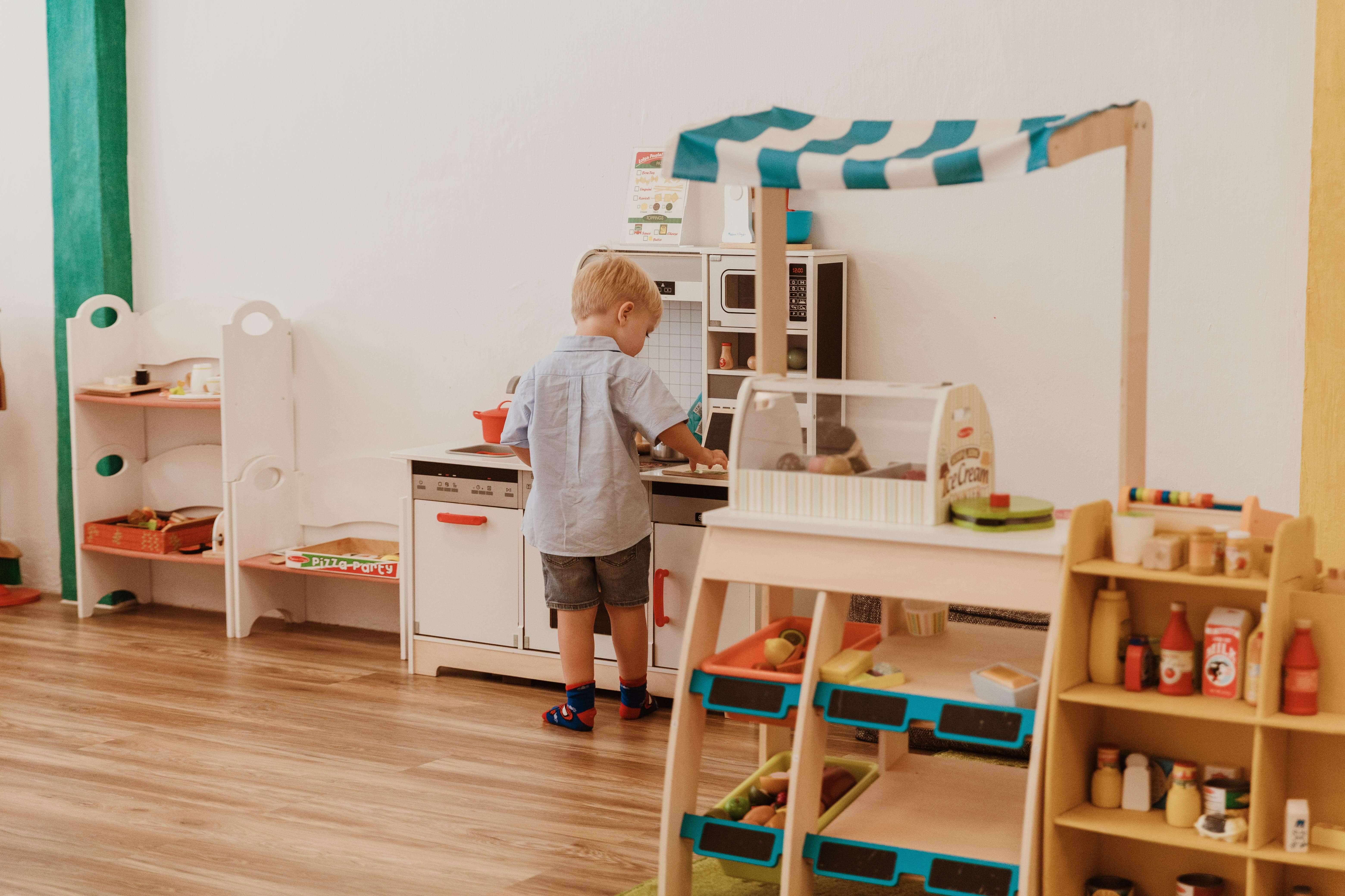 Child playing with party prop