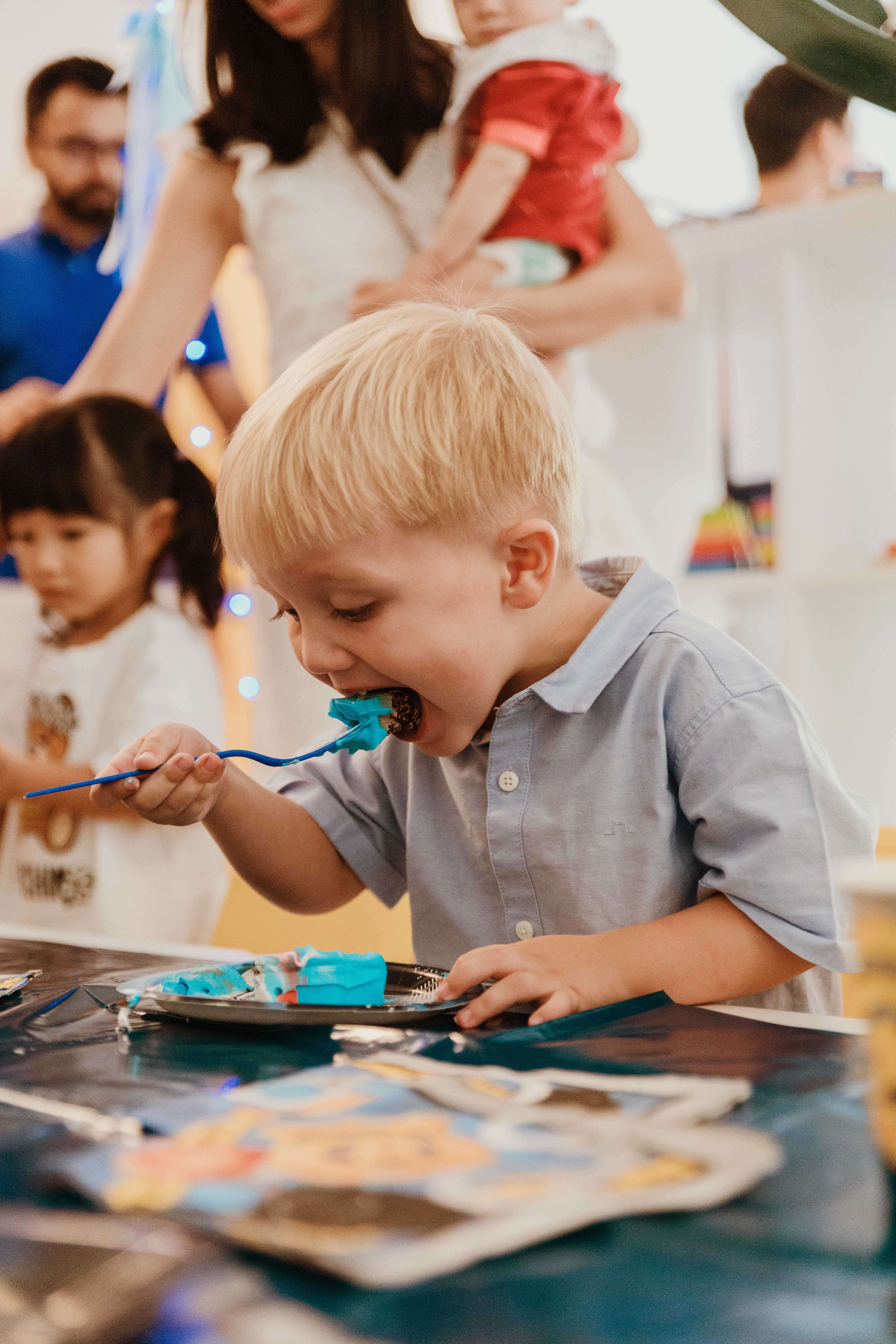 Child playing with party prop